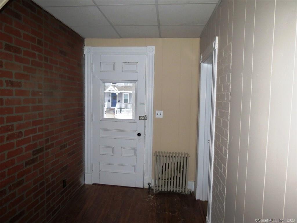 13 Wilcox Street Wethersfield, CT 06109 - Photo 6 of 21 a view of a hallway with a door