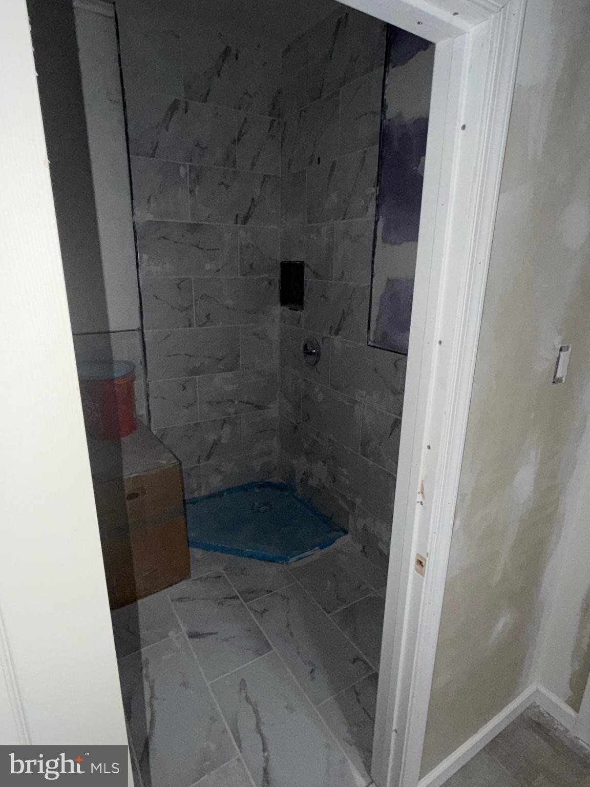 5609 Wyalusing Avenue Philadelphia, PA 19131 - Photo 18 of 36 a bathroom with a glass door shower