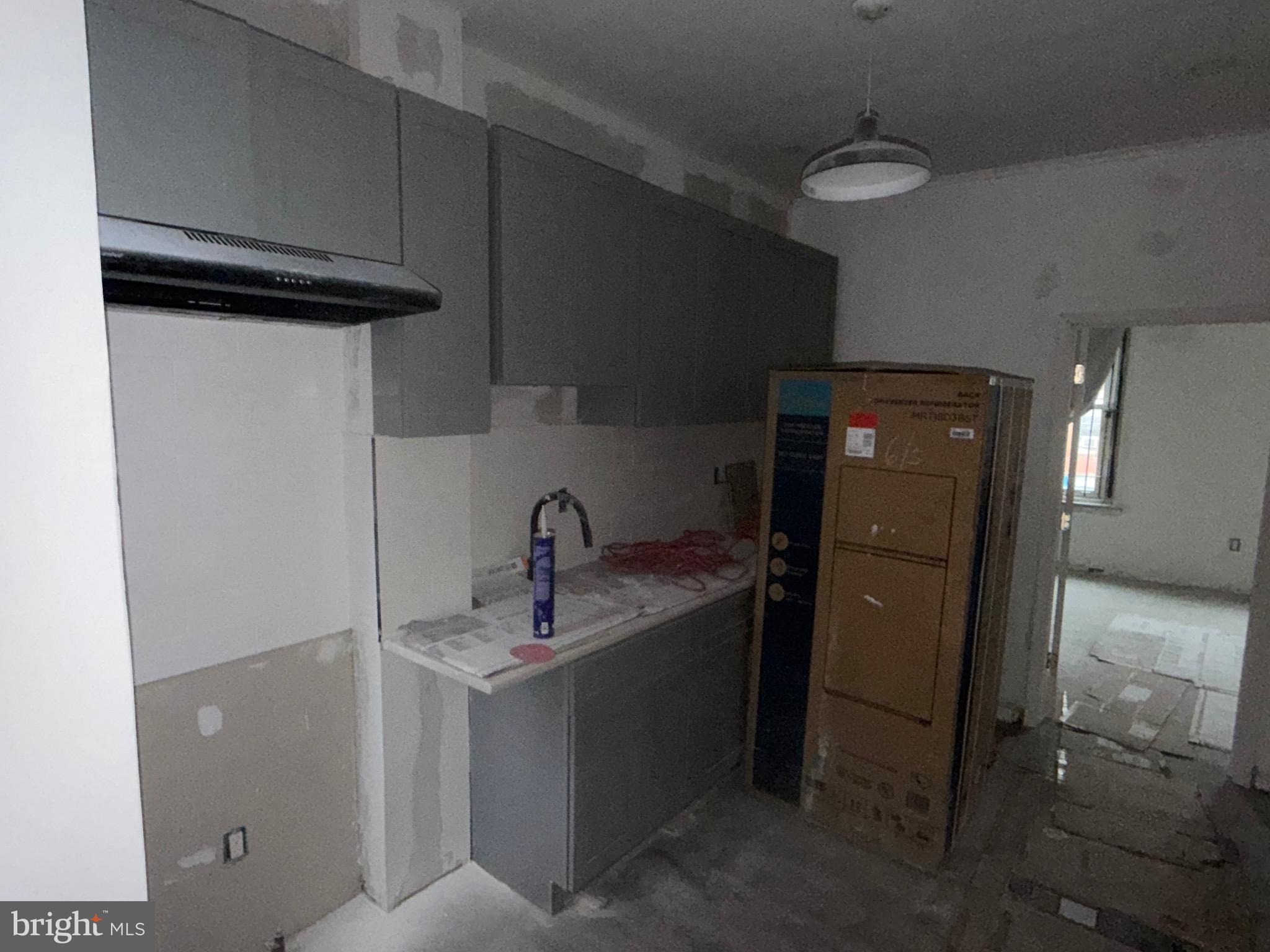 5609 Wyalusing Avenue Philadelphia, PA 19131 - Photo 20 of 36 a bathroom with a sink and mirror