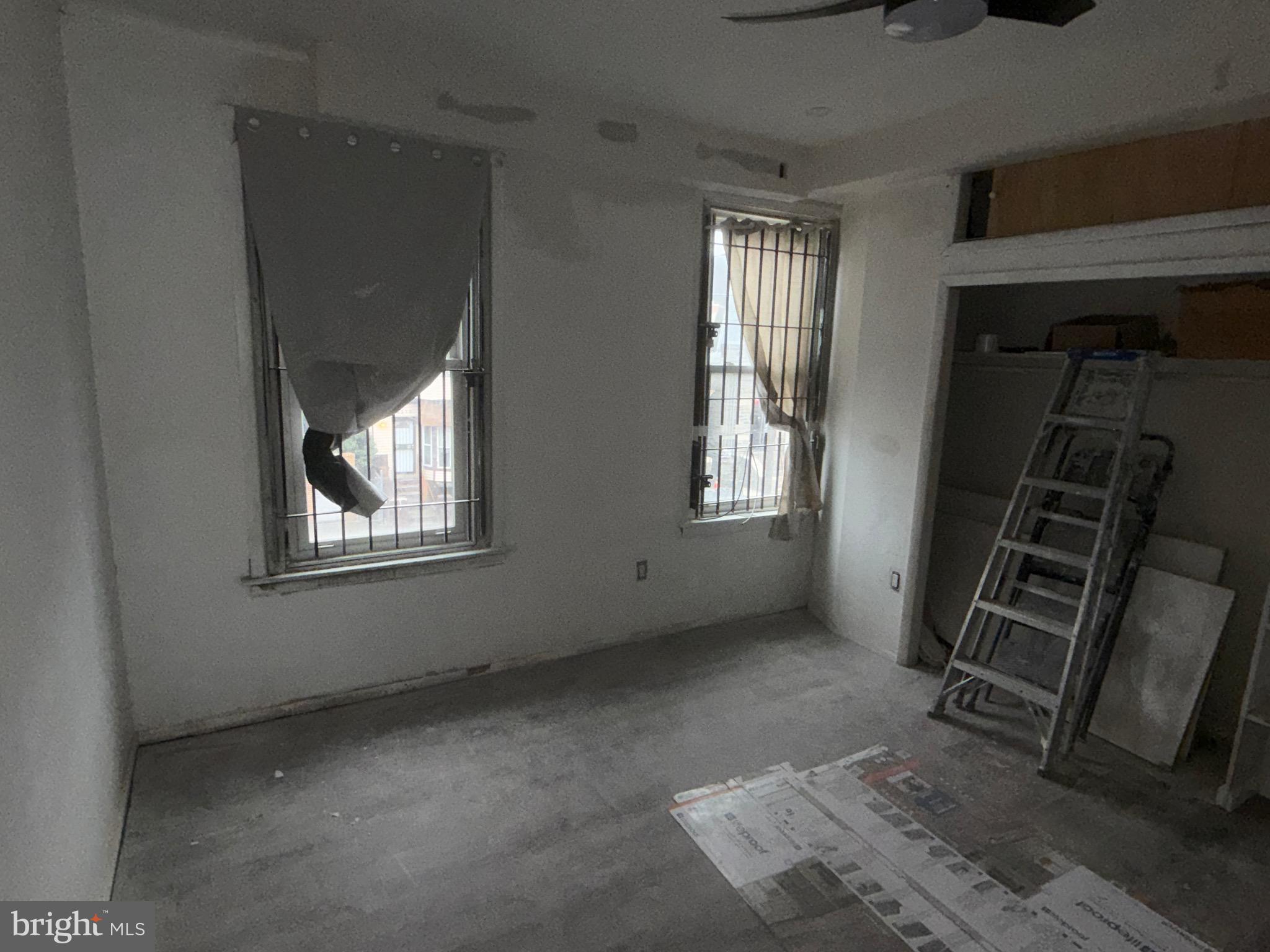 5609 Wyalusing Avenue Philadelphia, PA 19131 - Photo 21 of 36 an empty room with windows