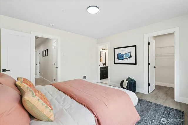 a bedroom with a bed and a couch