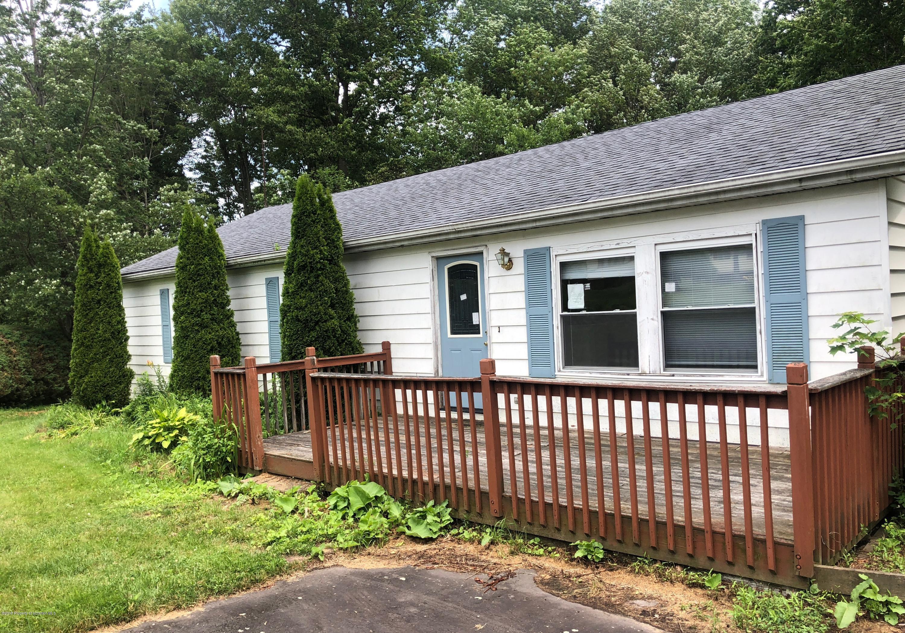 285 Log Rd Lake Lake Ariel, PA 18436 - Photo 1 of 12 a front view of a house with a garden