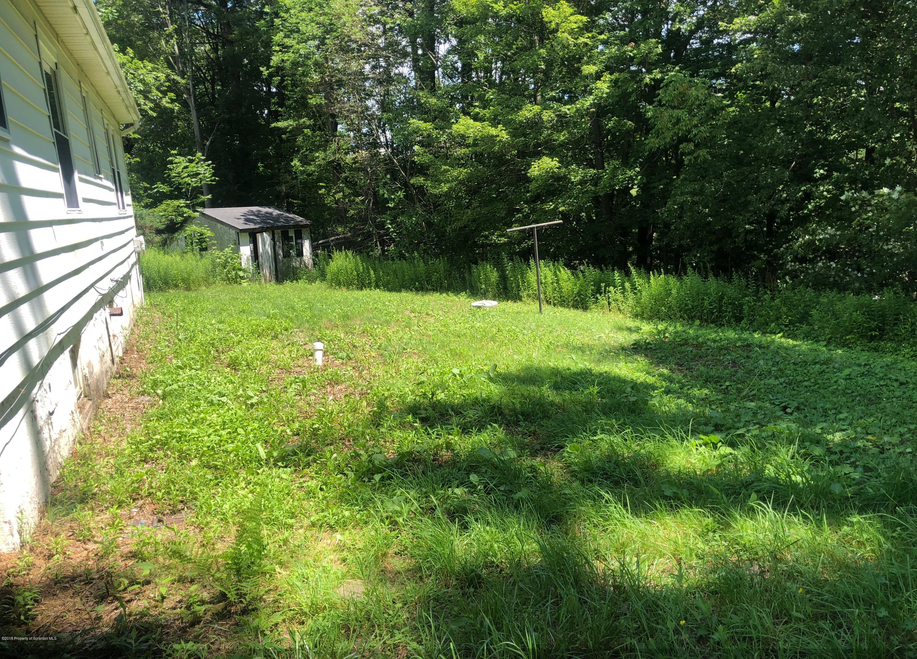 285 Log Rd Lake Lake Ariel, PA 18436 - Photo 12 of 12 a view of backyard with a table and chairs