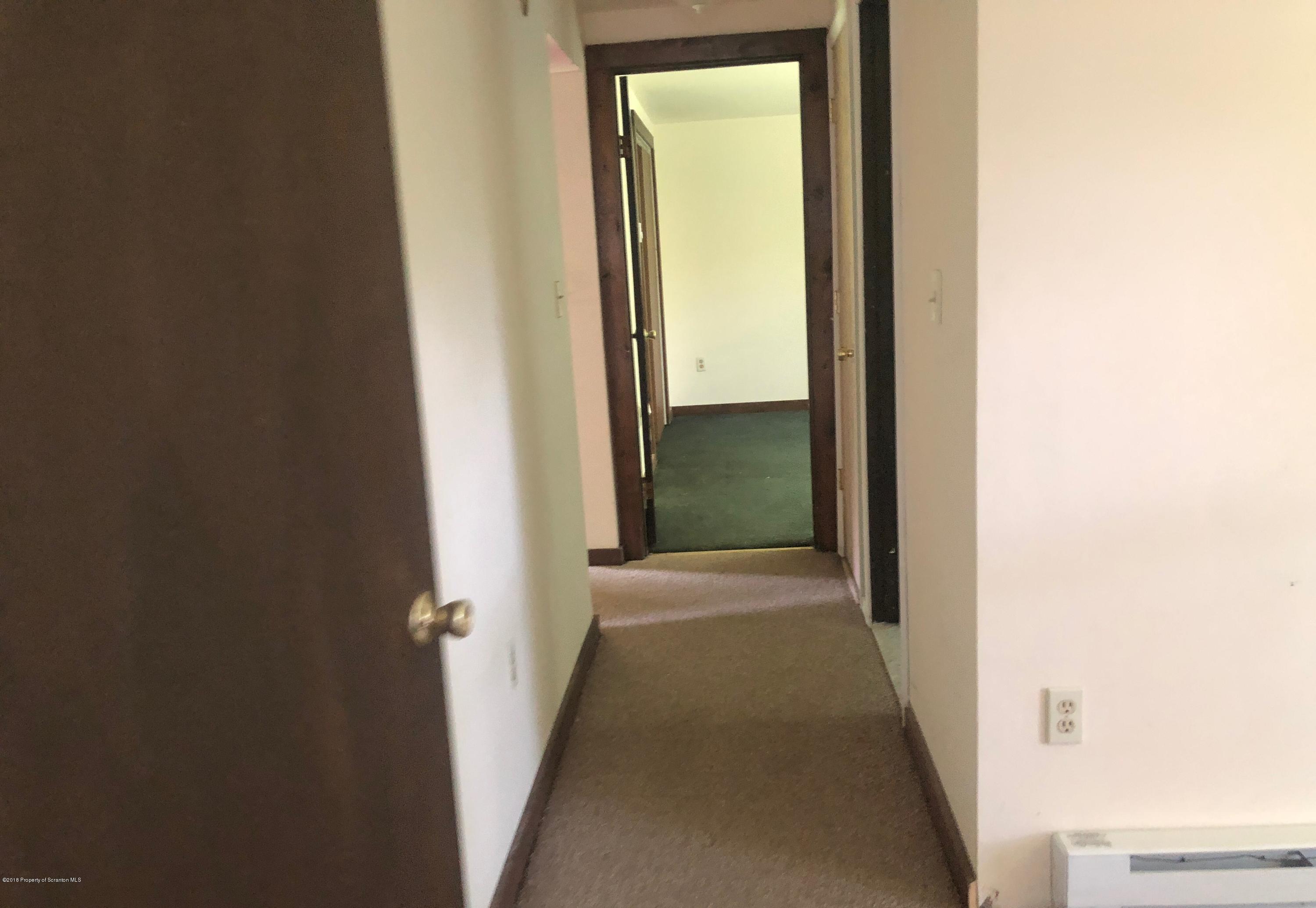 285 Log Rd Lake Lake Ariel, PA 18436 - Photo 4 of 12 a view of a hallway with wooden floor