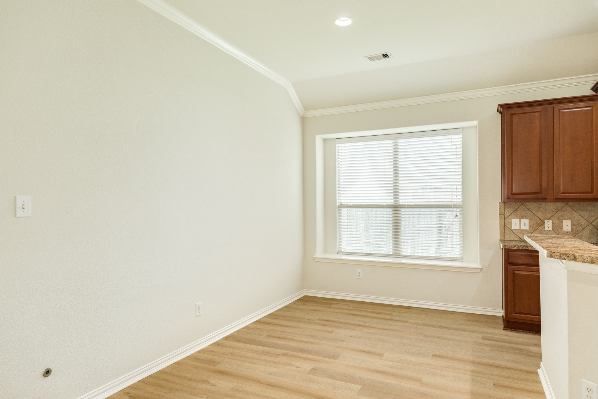 13417 Star Creek Lane Rosharon, TX 77583 - Photo 12 of 41 an empty room with wooden floor and windows