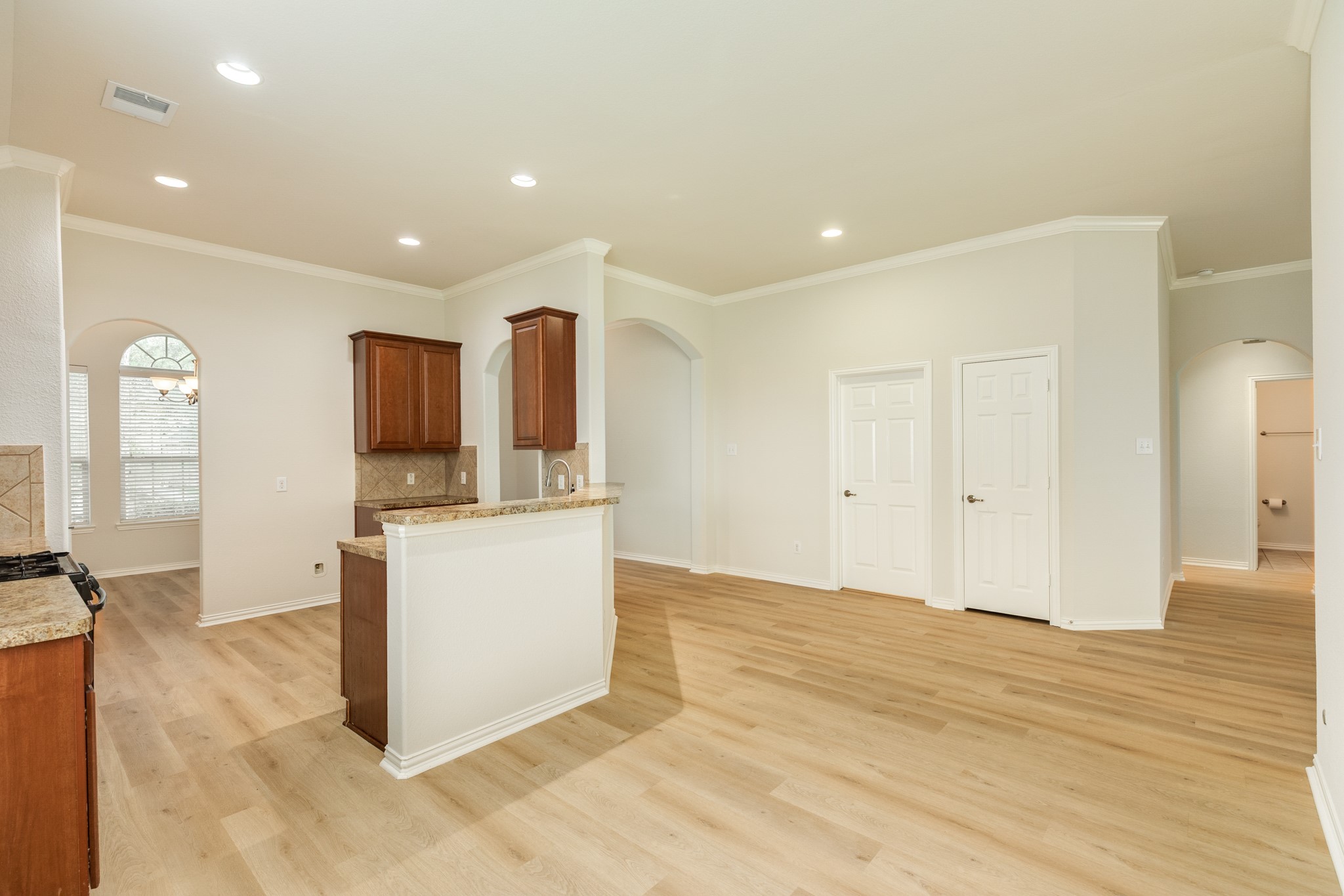13417 Star Creek Lane Rosharon, TX 77583 - Photo 13 of 41 a view of a kitchen with kitchen island wooden floor and window