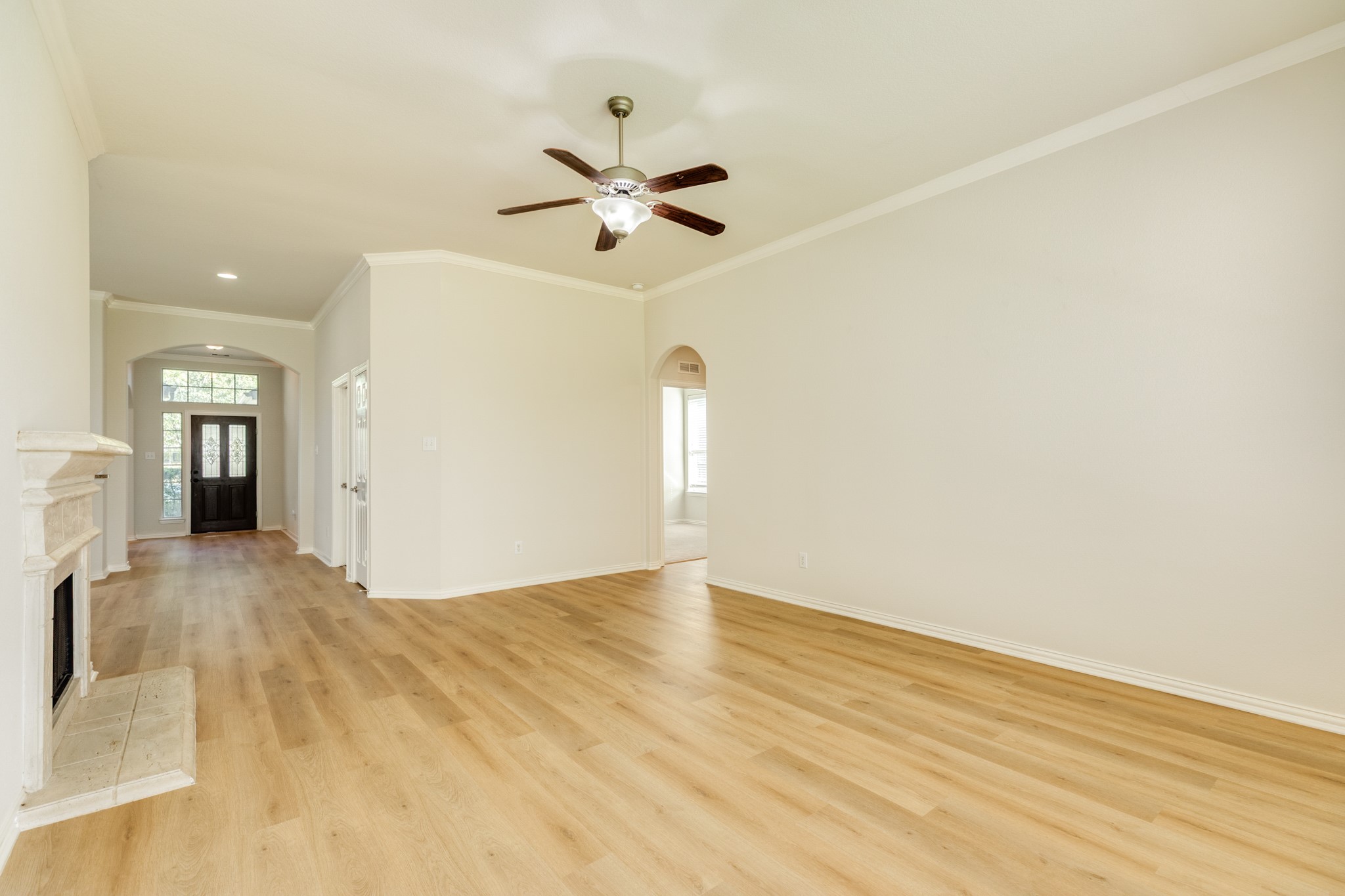 13417 Star Creek Lane Rosharon, TX 77583 - Photo 16 of 41 a view of empty room with wooden floor and ceiling fan