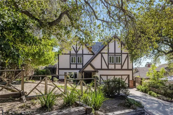 a house that has tree in front of it