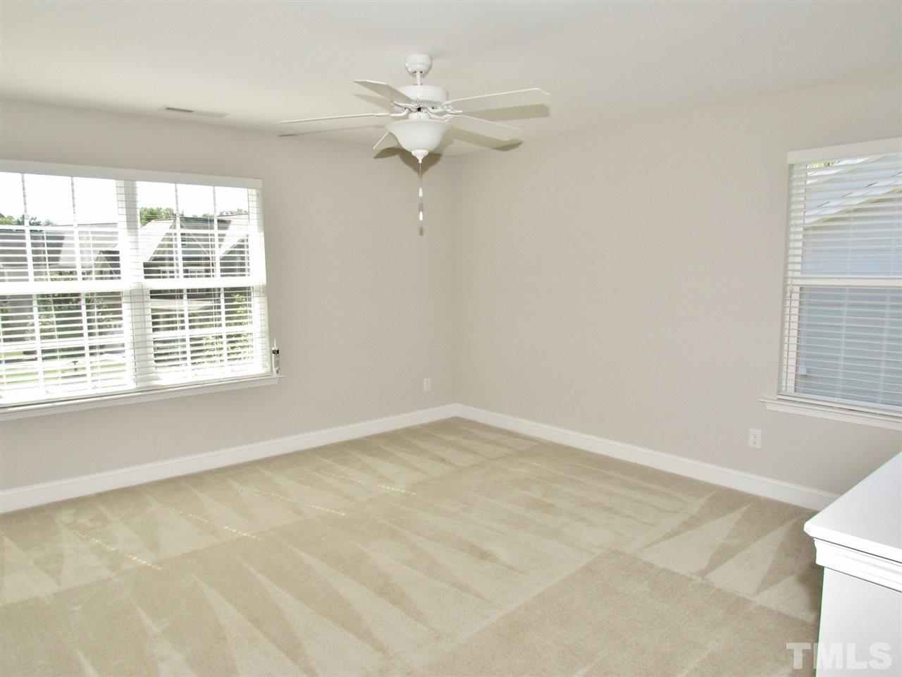 5713 Spring Glen Lane Raleigh, NC 27616 - Photo 14 of 25 an empty room with a window