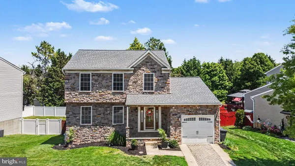 a aerial view of a house with a yard