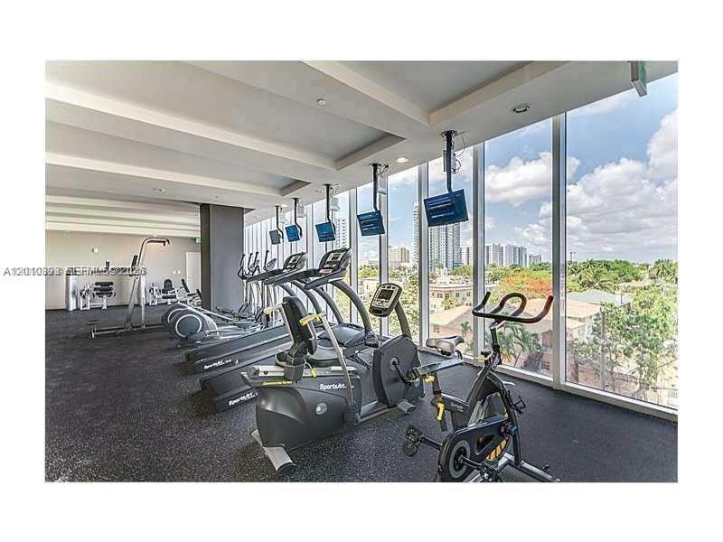 600 Northeast 27th Street, Unit 2001 Miami, FL 33137 - Photo 4 of 20 a room with gym equipment and large window