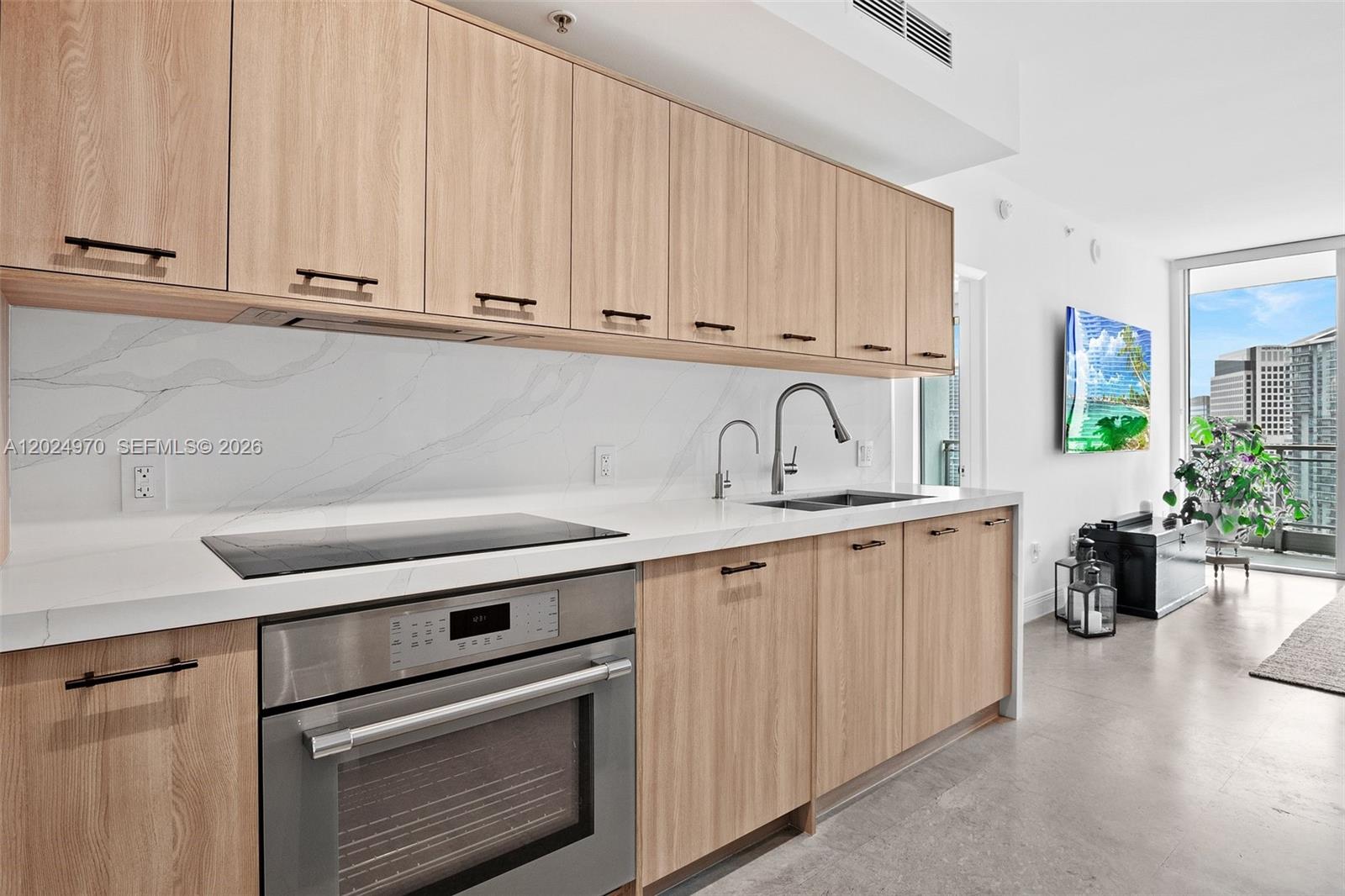 90 Southwest 3rd Street, Unit 3810 Miami, FL 33130 - Photo 20 of 45 a kitchen with stainless steel appliances granite countertop a sink stove and cabinets