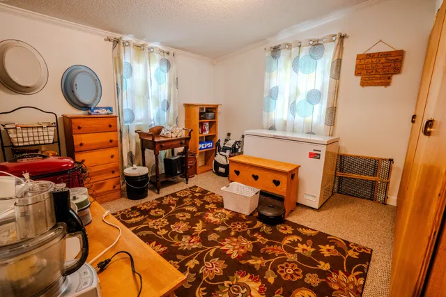 a room with lots of books and furniture