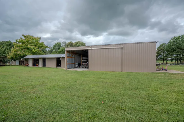 a view of a patio with table and chairs and potted plants