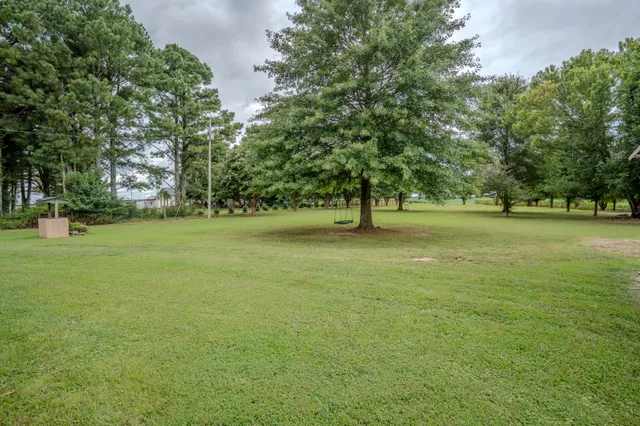 a front view of a house with outdoor seating