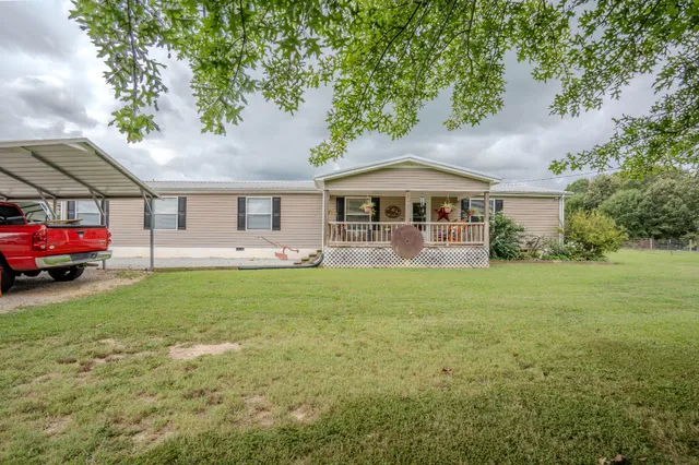 a view of outdoor space with deck and yard