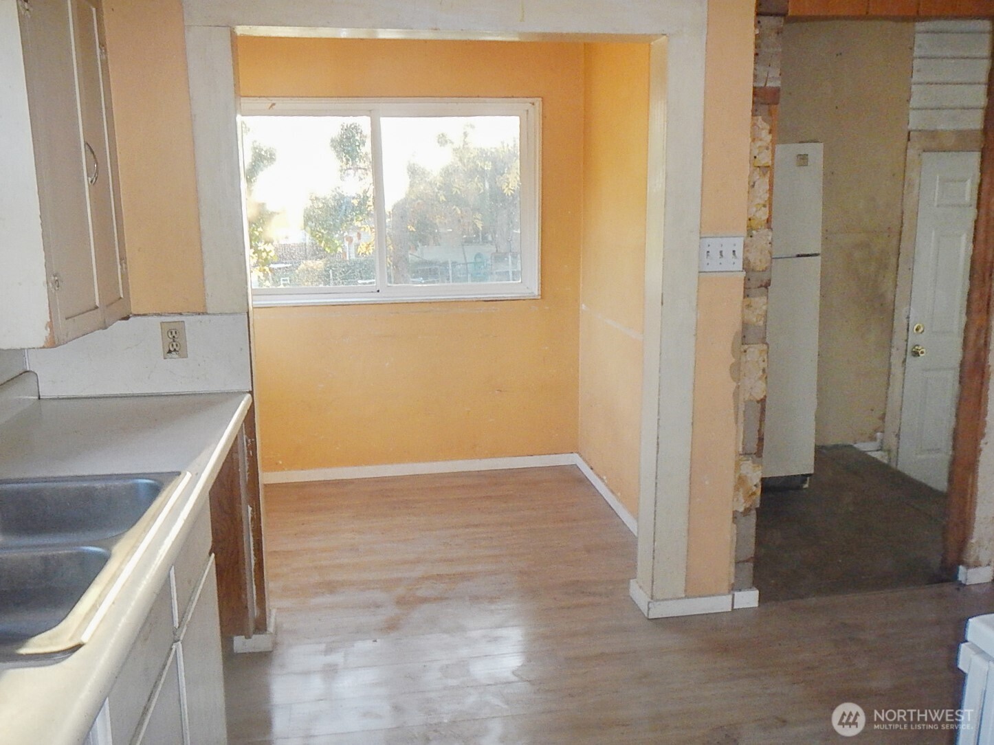 611 North Front Street Dayton, WA 99328 - Photo 20 of 32 a view of a kitchen that shows a sink dishwasher and a microwave oven