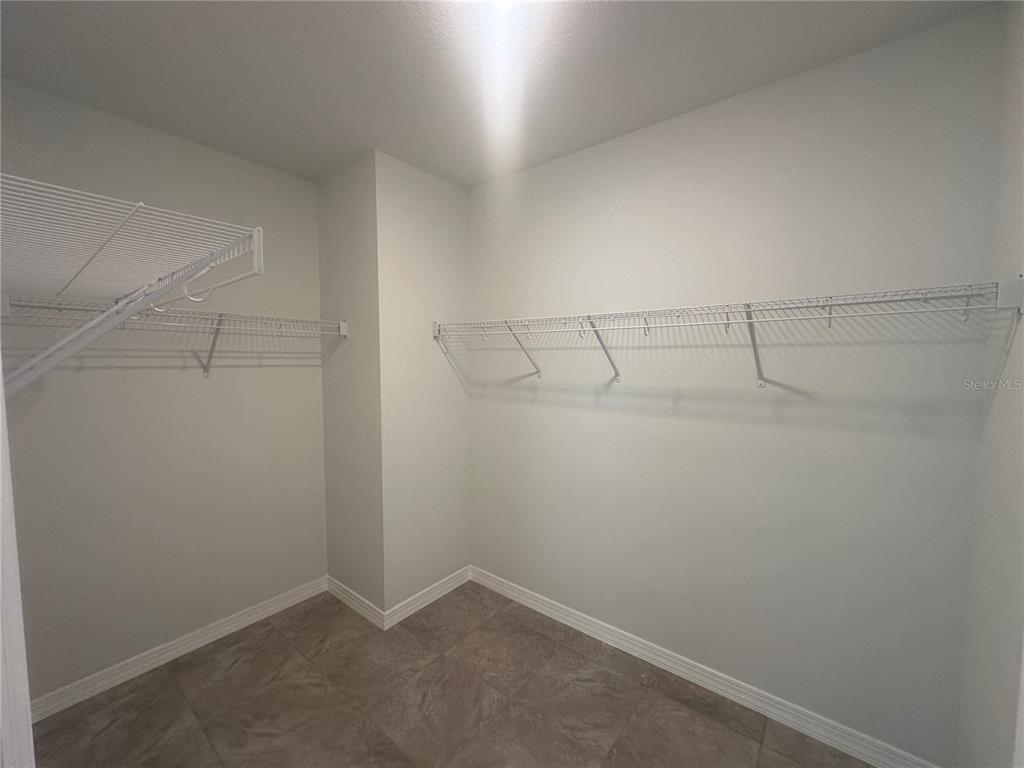 8795 Southwest 135th Place Ocala, FL 34473 - Photo 17 of 22 a view of a room with racks on the wall
