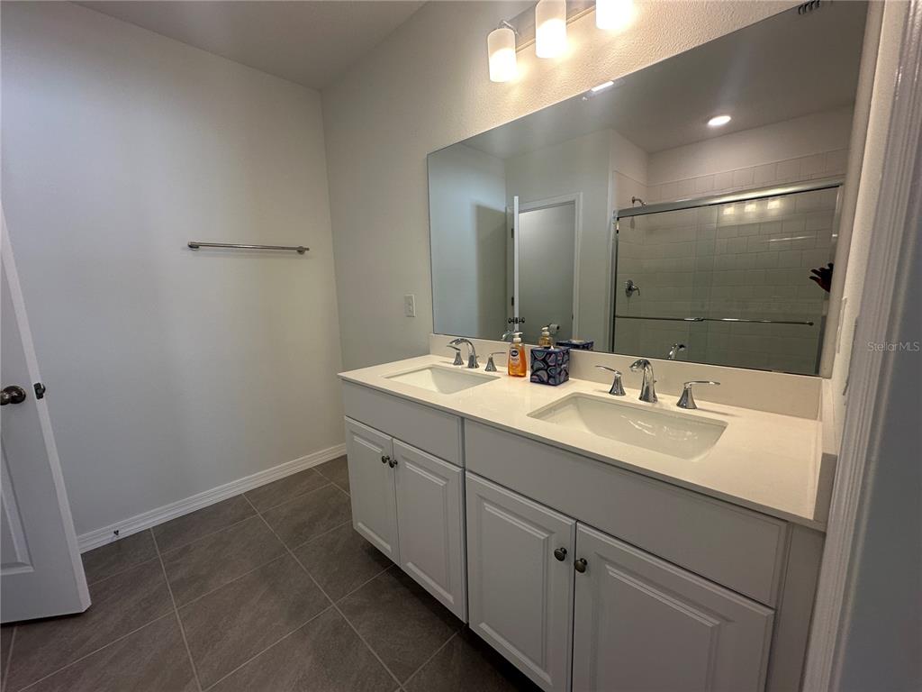 8795 Southwest 135th Place Ocala, FL 34473 - Photo 19 of 22 a bathroom with a sink and a mirror
