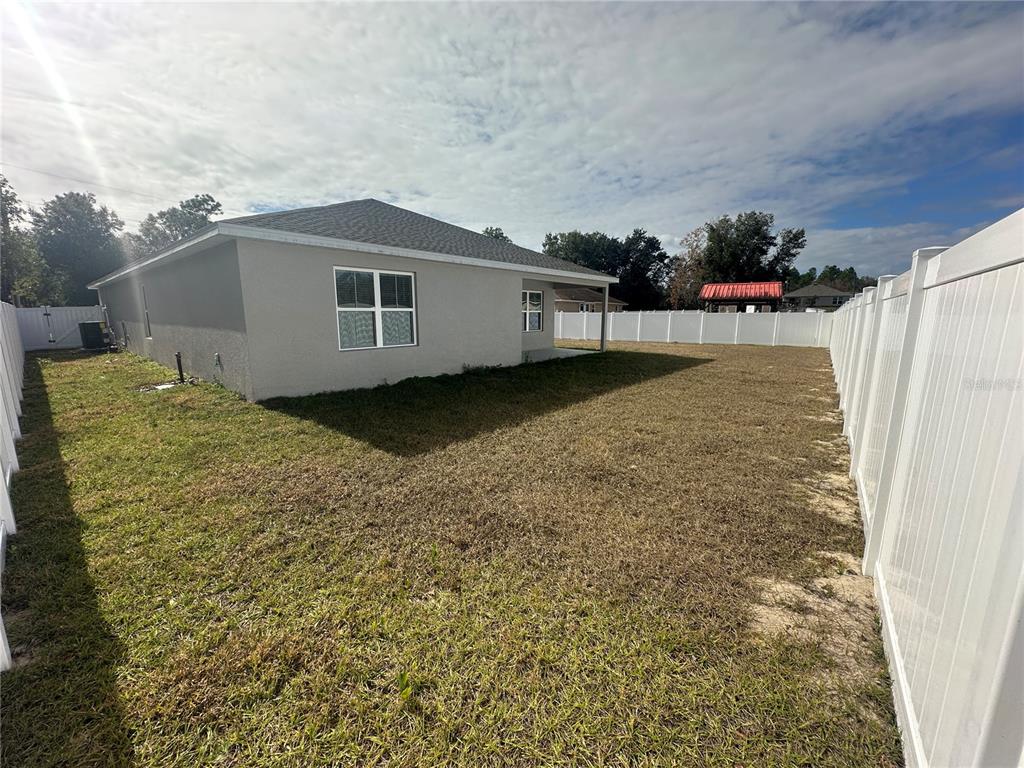 8795 Southwest 135th Place Ocala, FL 34473 - Photo 20 of 22 a backyard of a house