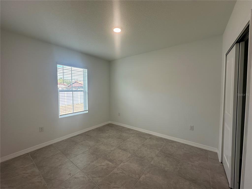 8795 Southwest 135th Place Ocala, FL 34473 - Photo 5 of 22 an empty room with a window
