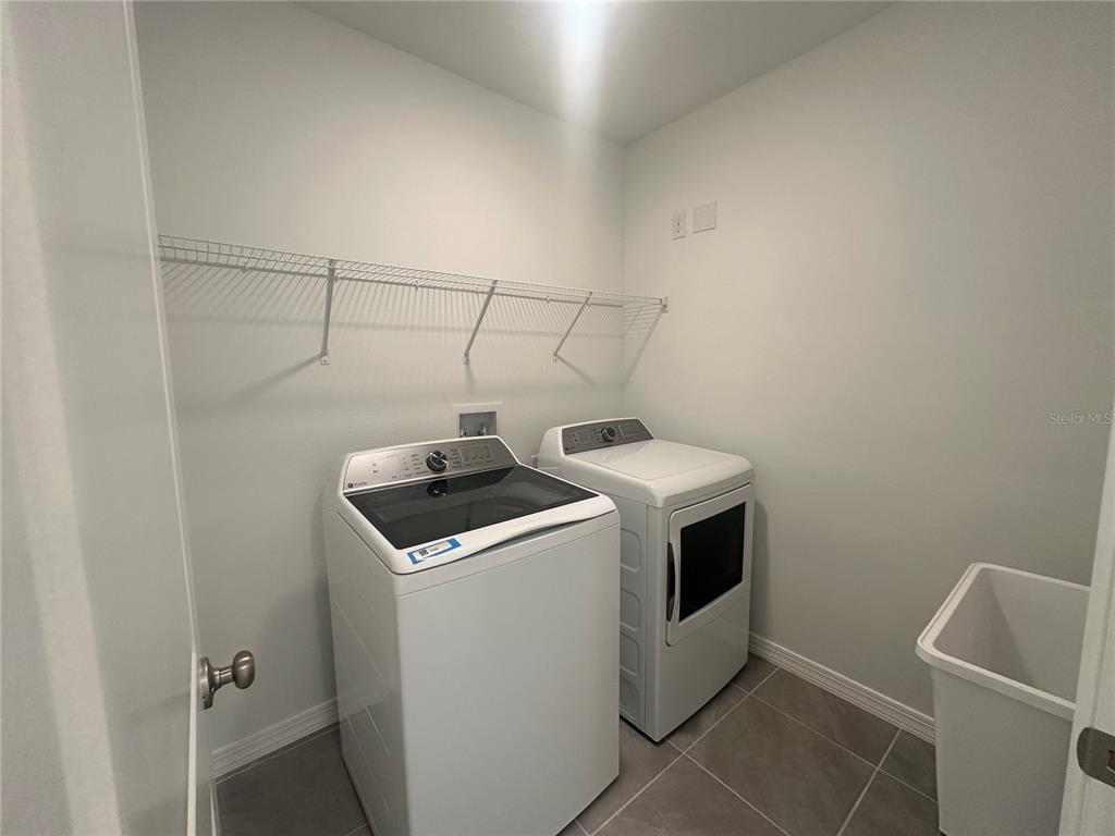 8795 Southwest 135th Place Ocala, FL 34473 - Photo 10 of 22 a utility room with dryer and washer