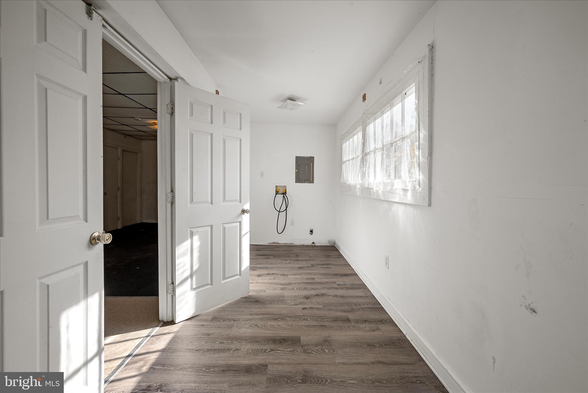 751-761 Old Charles Town Road Stephenson, VA 22656 - Photo 29 of 58 a view of a hallway with wooden floor and staircase