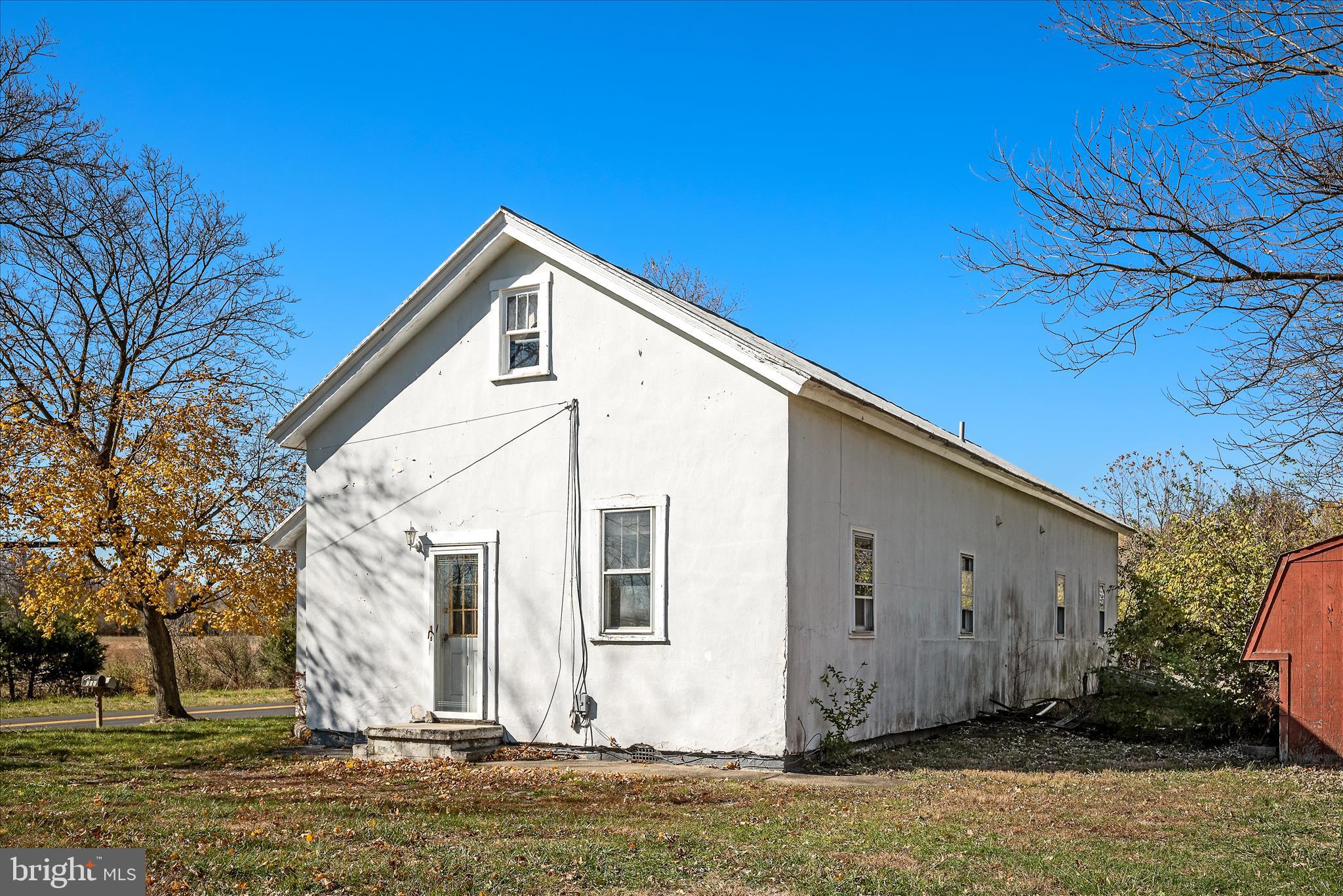 751-761 Old Charles Town Road Stephenson, VA 22656 - Photo 36 of 58 a front view of a house with a yard