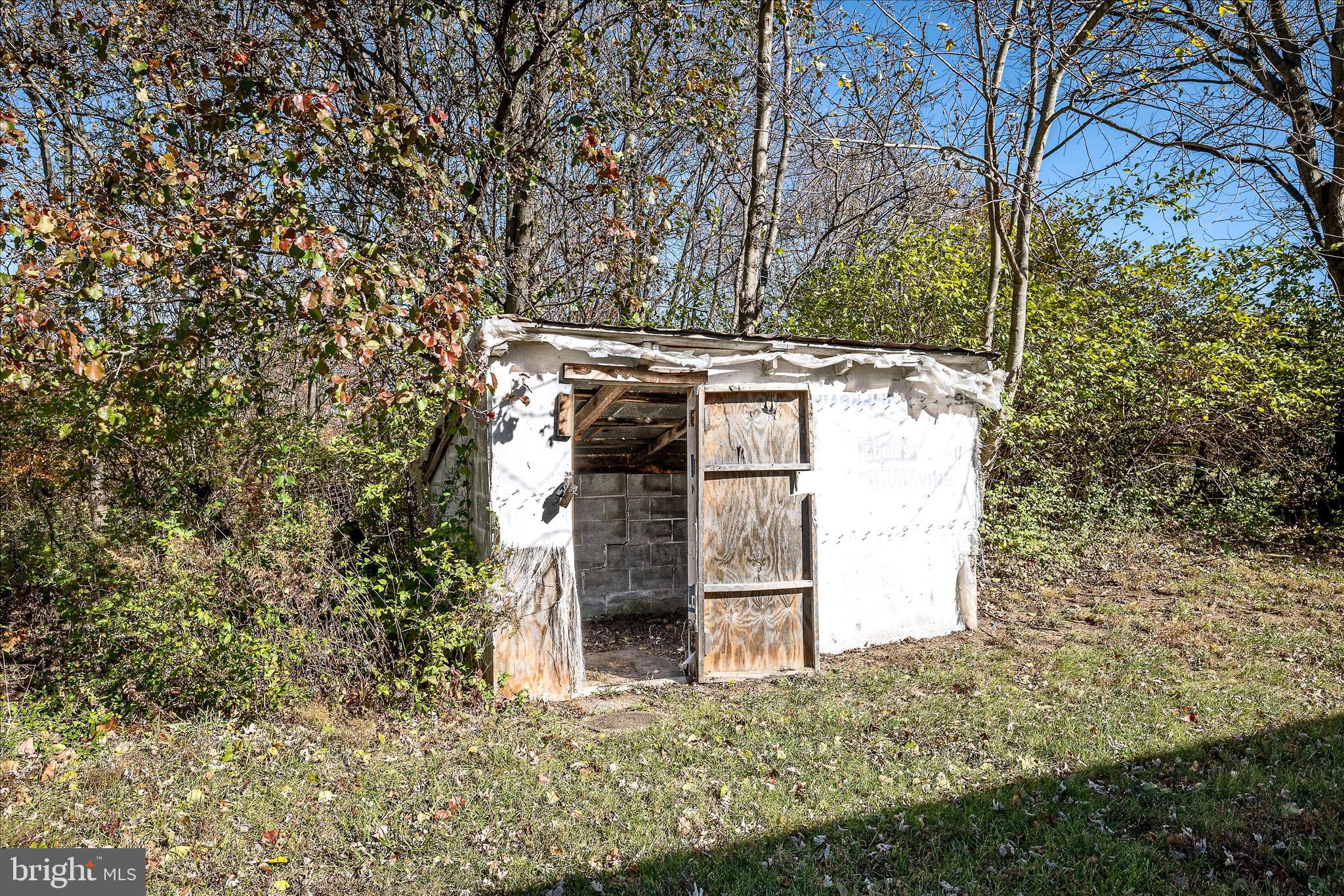 751-761 Old Charles Town Road Stephenson, VA 22656 - Photo 42 of 58 a building with trees in front of it
