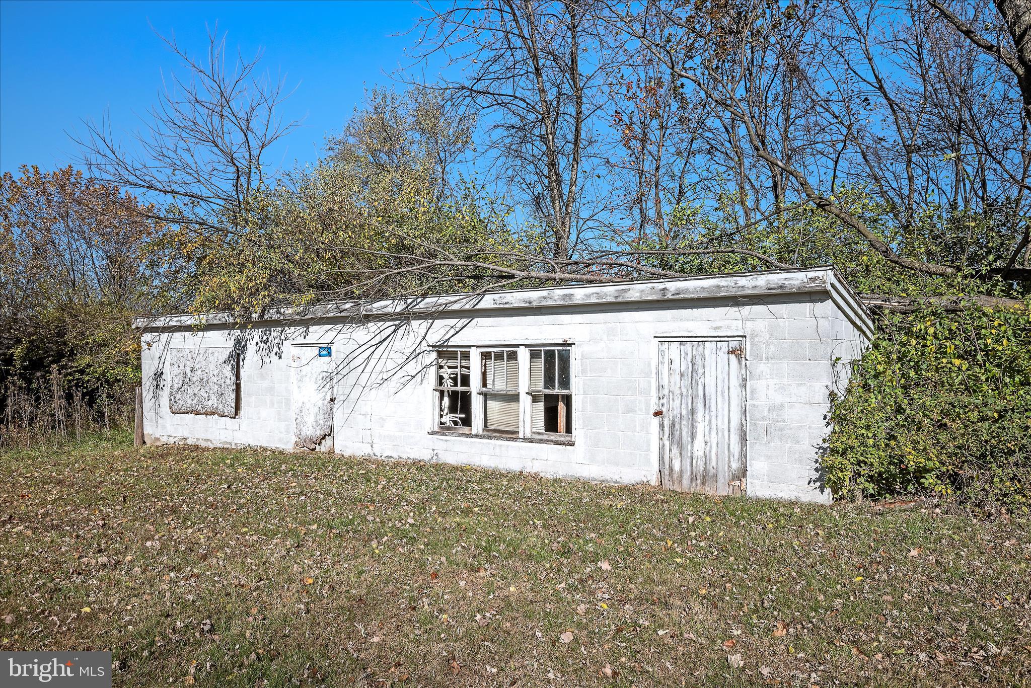 751-761 Old Charles Town Road Stephenson, VA 22656 - Photo 43 of 58 a front view of a house with a garden