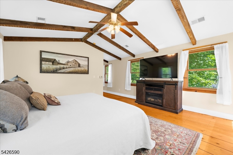 179 Lindbergh Road Hopewell, NJ 08525 - Photo 23 of 46 a bedroom with a bed and a television