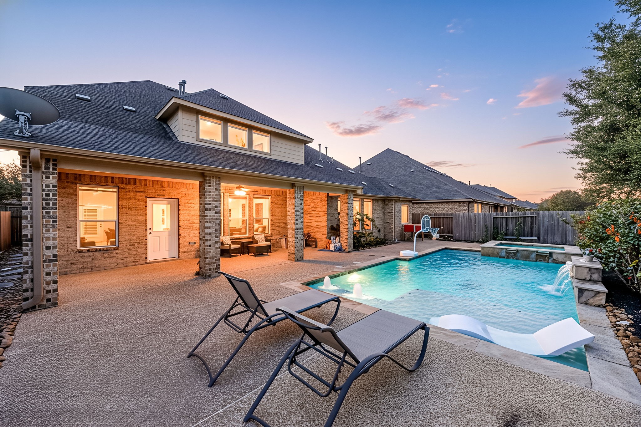 8169 Tranquil Lake Way Conroe, TX 77385 - Photo 2 of 50 a view of a house with backyard porch and sitting area