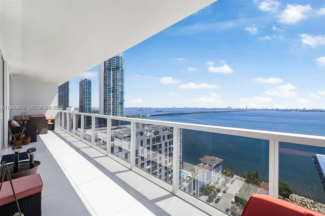 a view of balcony with furniture