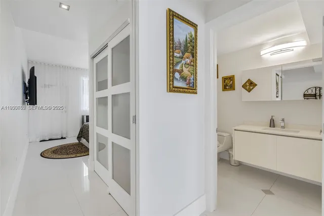 a bathroom with a sink toilet and mirror