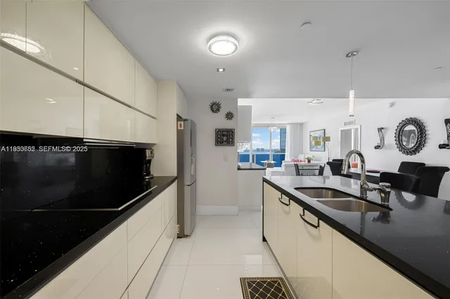 a kitchen with counter top space and stainless steel appliances