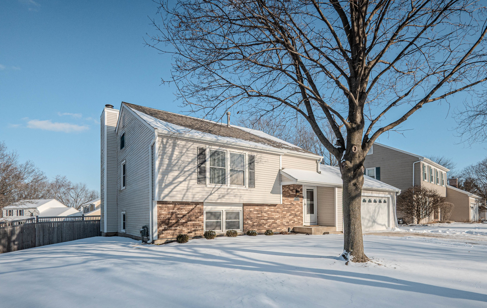 965 Independence Avenue St. Charles, IL 60174 - Photo 2 of 28 a front view of a house with a road