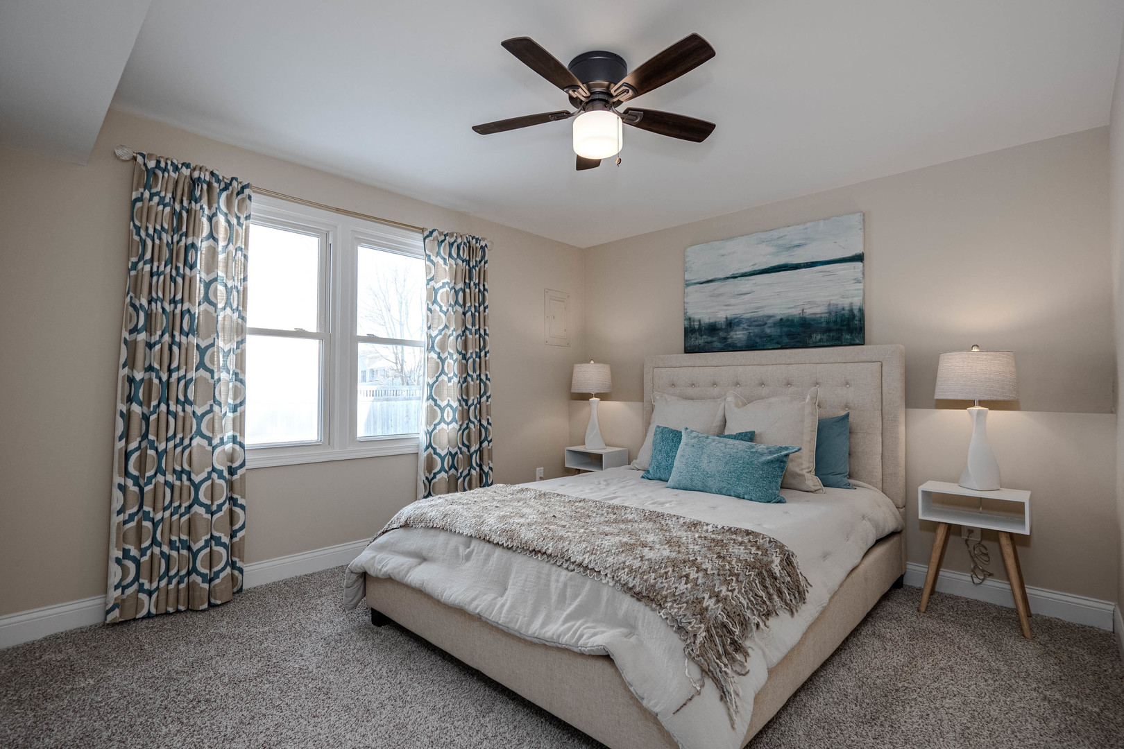 965 Independence Avenue St. Charles, IL 60174 - Photo 22 of 28 a bedroom with a large bed and a chandelier fan