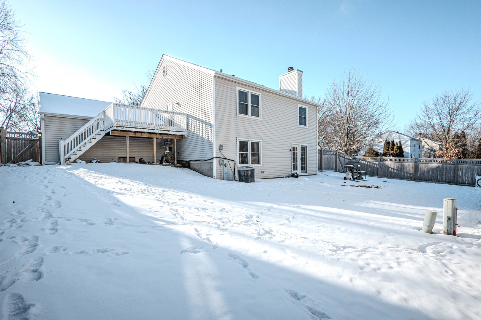 965 Independence Avenue St. Charles, IL 60174 - Photo 27 of 28 a view of a house with snow on the road