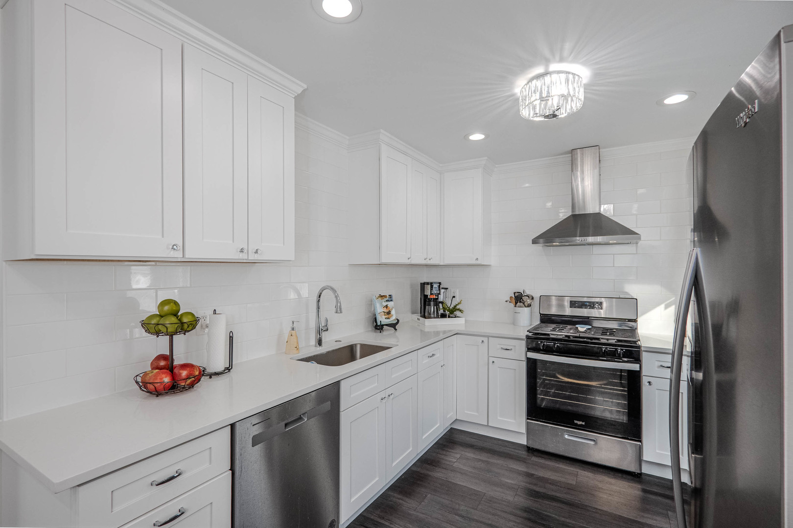 965 Independence Avenue St. Charles, IL 60174 - Photo 8 of 28 a kitchen with a sink white cabinets and stainless steel appliances