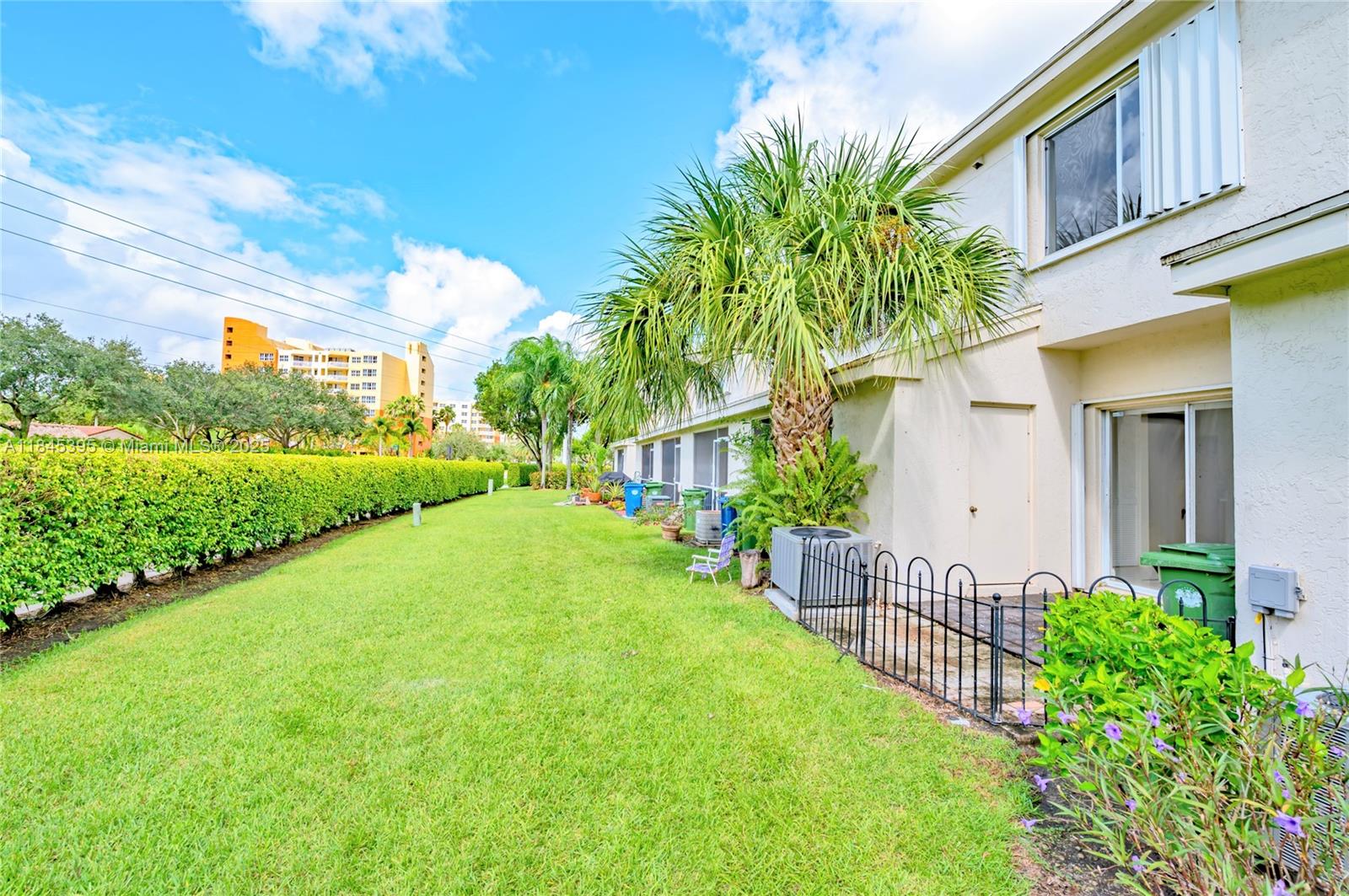 69 Simonton Circle, Unit 1 Weston, FL 33326 - Photo 12 of 23 a view of a house with a yard and plants