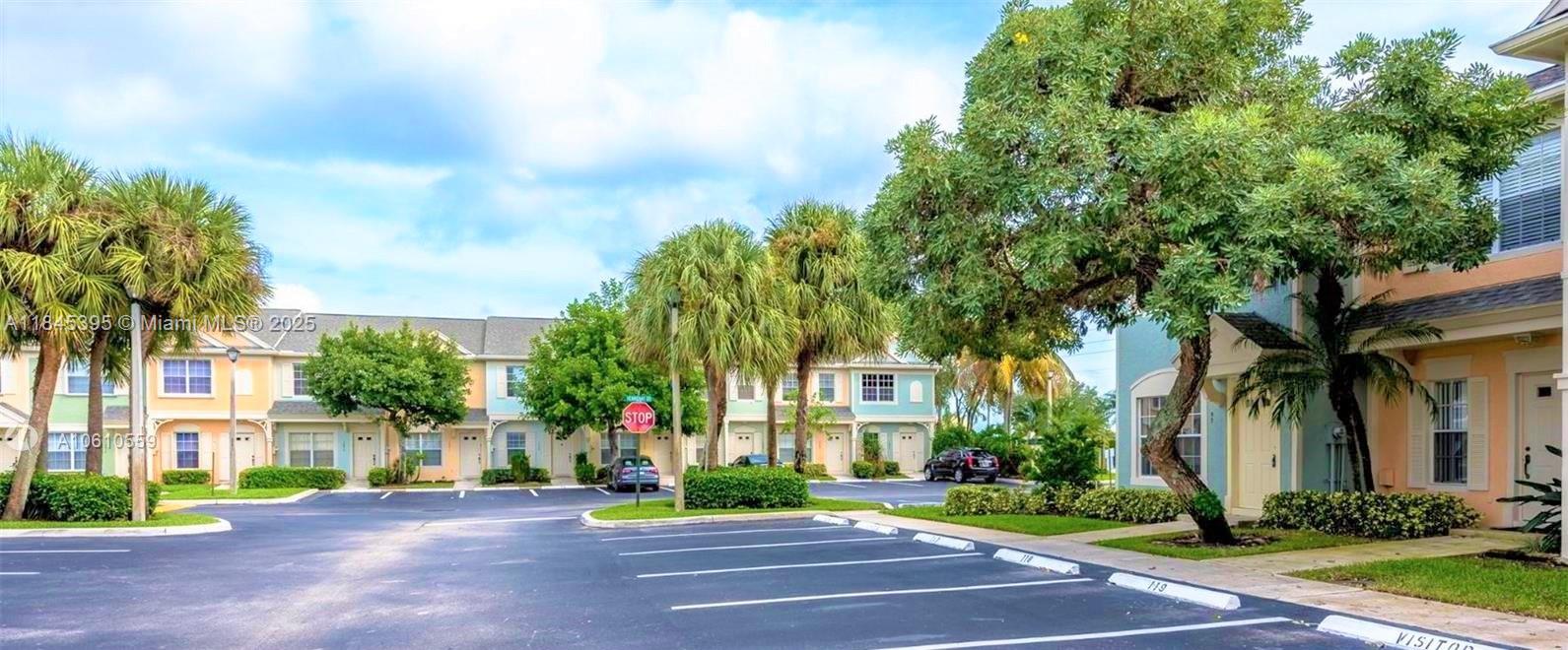 69 Simonton Circle, Unit 1 Weston, FL 33326 - Photo 14 of 23 a view of a street with a building in the background
