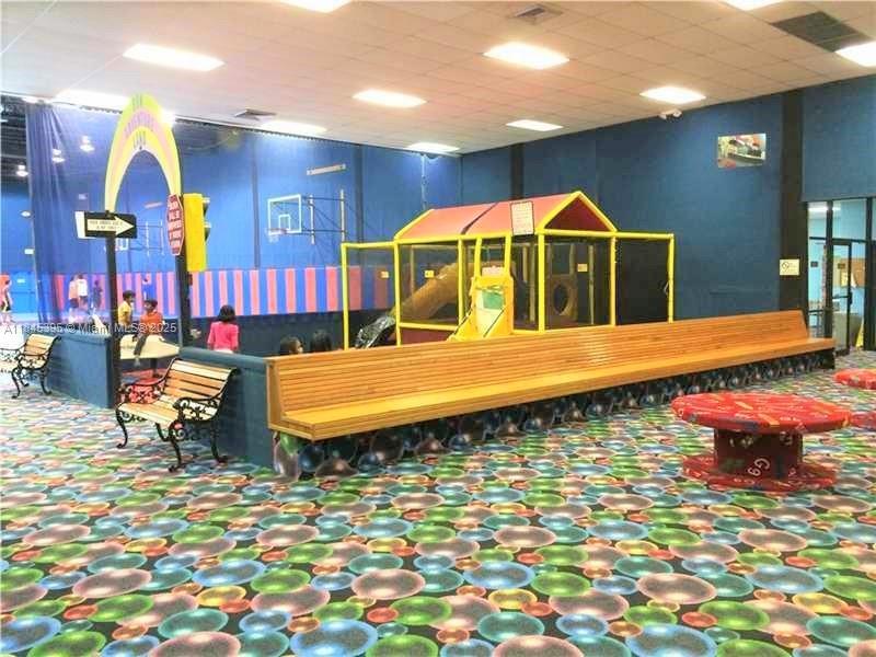 69 Simonton Circle, Unit 1 Weston, FL 33326 - Photo 18 of 23 a bathroom with a sink a mirror and vanity