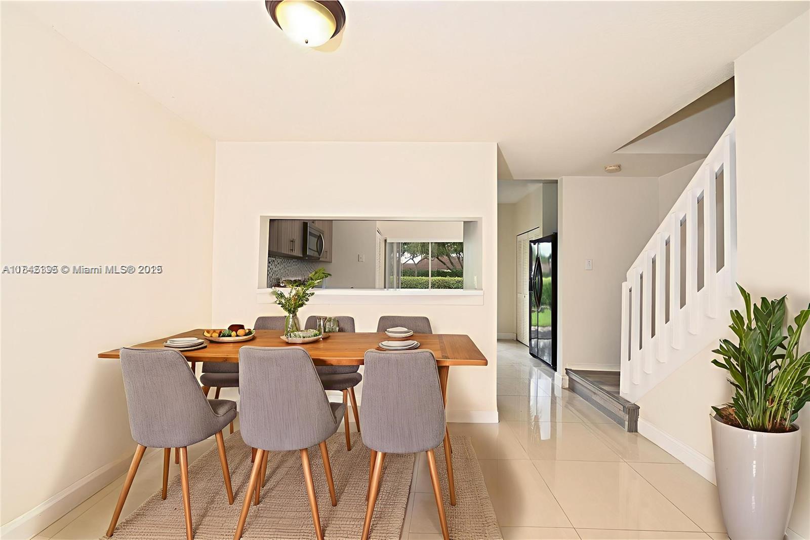 69 Simonton Circle, Unit 1 Weston, FL 33326 - Photo 3 of 23 a view of a dining room with furniture
