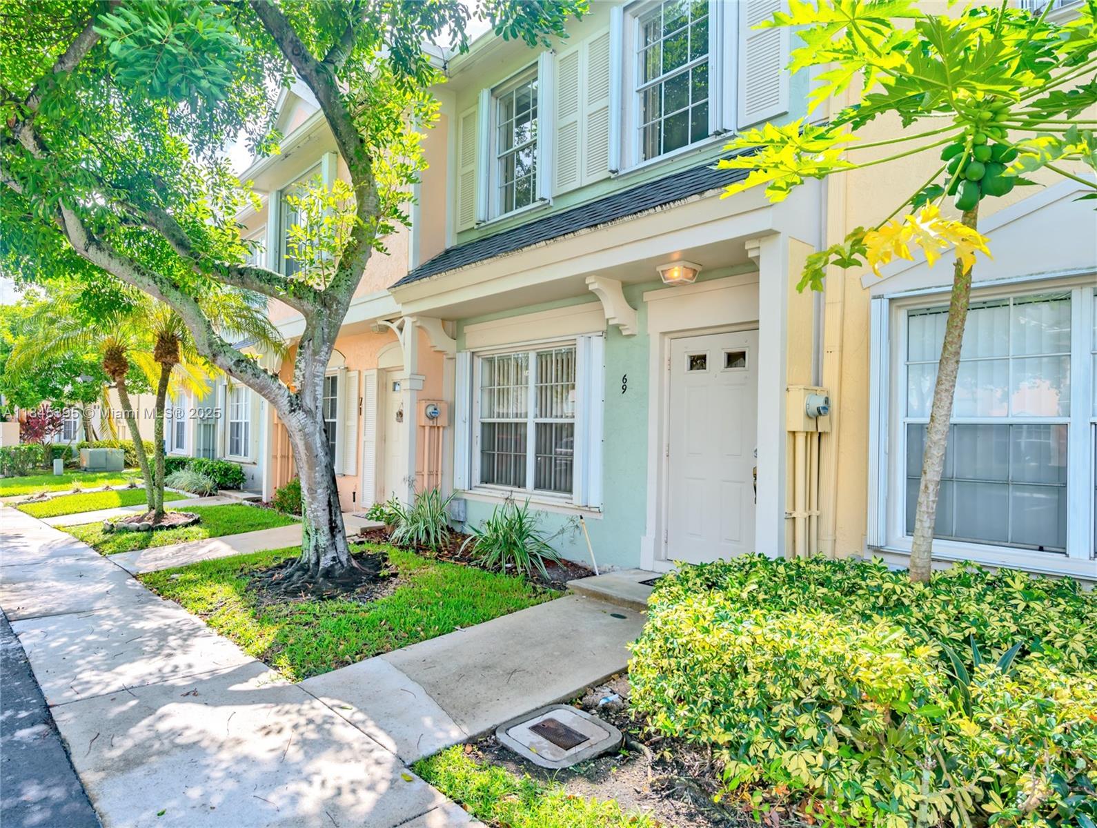 69 Simonton Circle, Unit 1 Weston, FL 33326 - Photo 9 of 23 a front view of a house with garden
