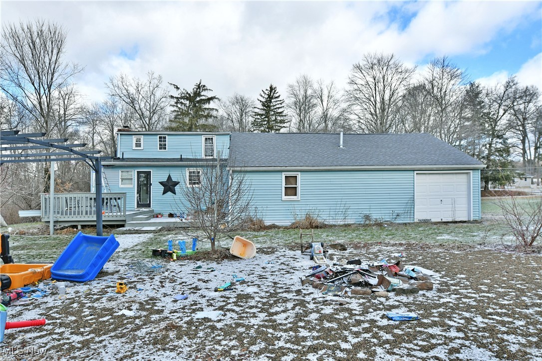 6370 Stewart Sharon Road Hubbard, OH 44425 - Photo 17 of 19 Snow covered house featuring a garage and a deck