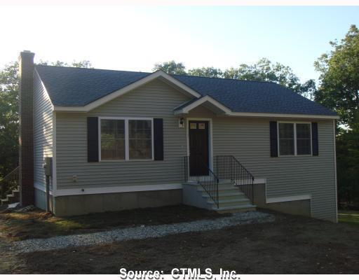 Lot#6 Mason Hill Road Dayville, CT 06241 - Photo 1 of 1 a front view of a house with a yard