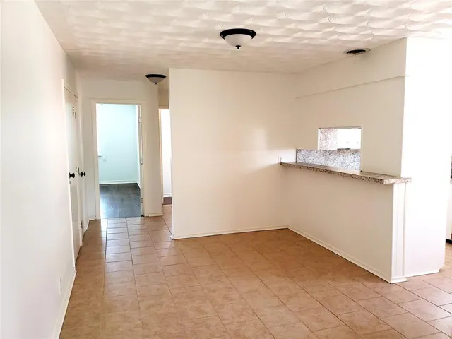 a view of a room that has wooden floor in it