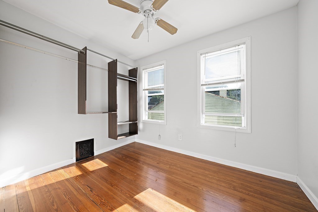7 Tolman Street, Unit 2 Boston, MA 02122 - Photo 12 of 13 a view of empty room with wooden floor and fan