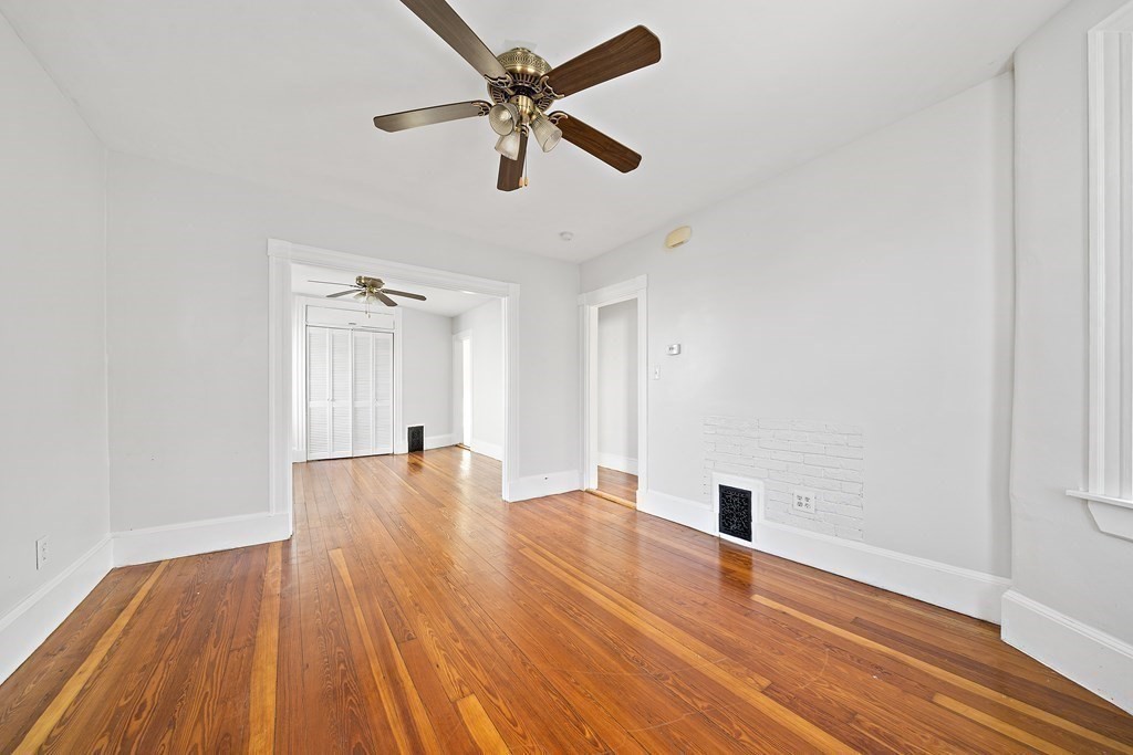 7 Tolman Street, Unit 2 Boston, MA 02122 - Photo 4 of 13 a big room with wooden floor and windows