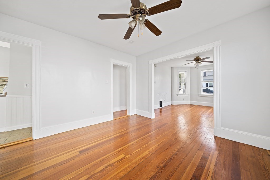 7 Tolman Street, Unit 2 Boston, MA 02122 - Photo 6 of 13 a view of empty room with wooden floor and fan
